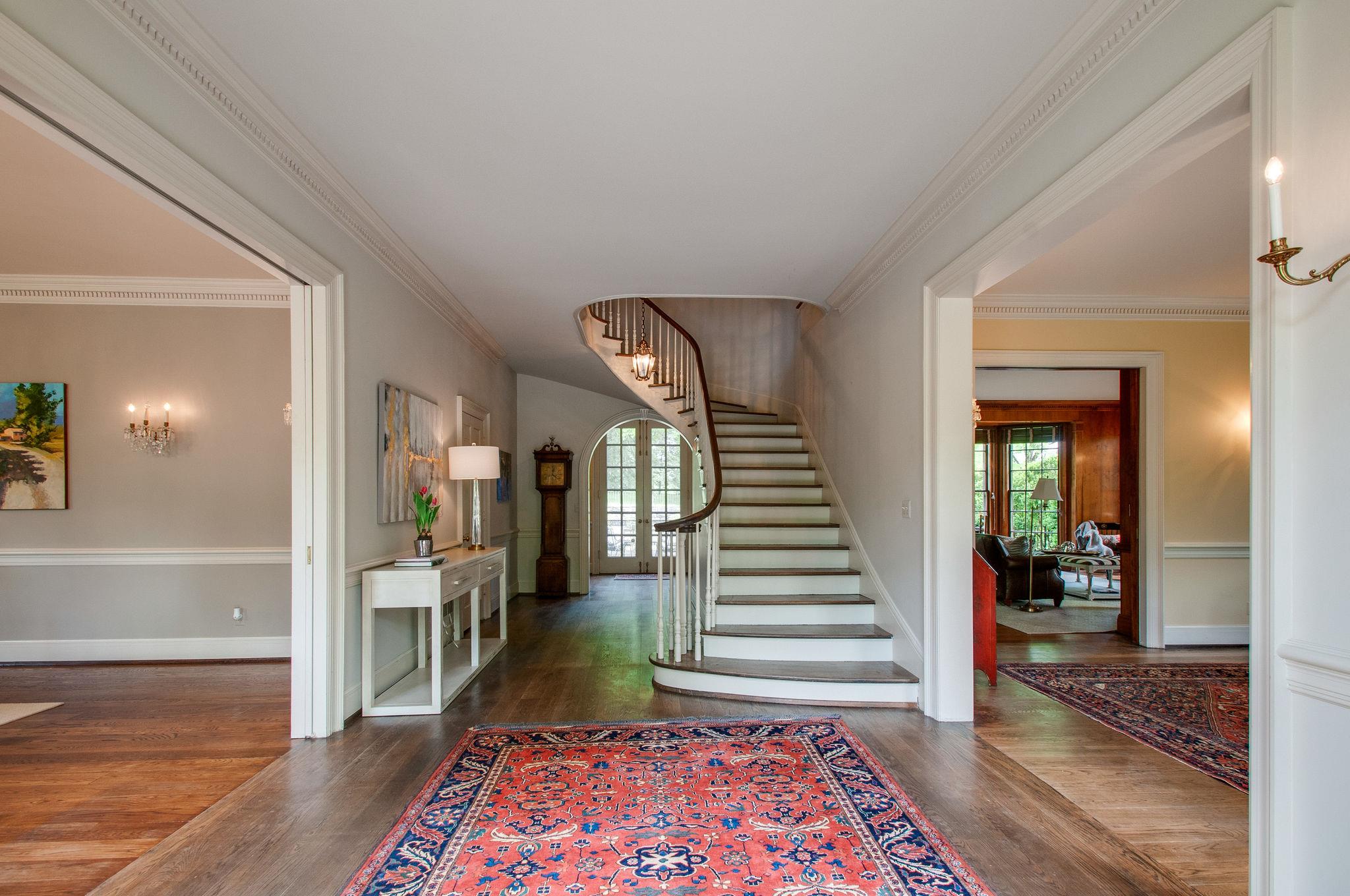 4737 Post Road Nashville, TN 37205 - Photo 8 of 30 a view of a hallway with wooden floor and windows