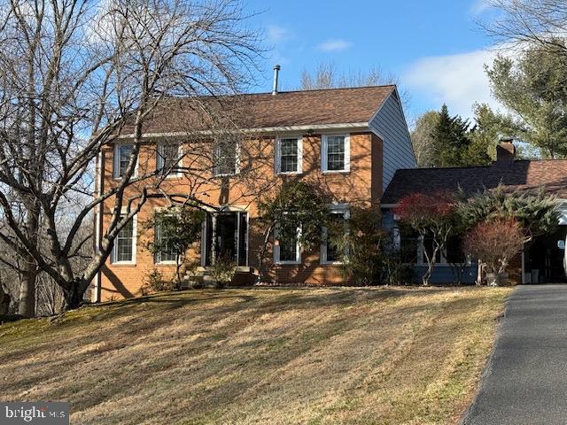 16424 Montecrest Lane Gaithersburg, MD 20878 - Photo 1 of 19 a view of a building with snow on the road