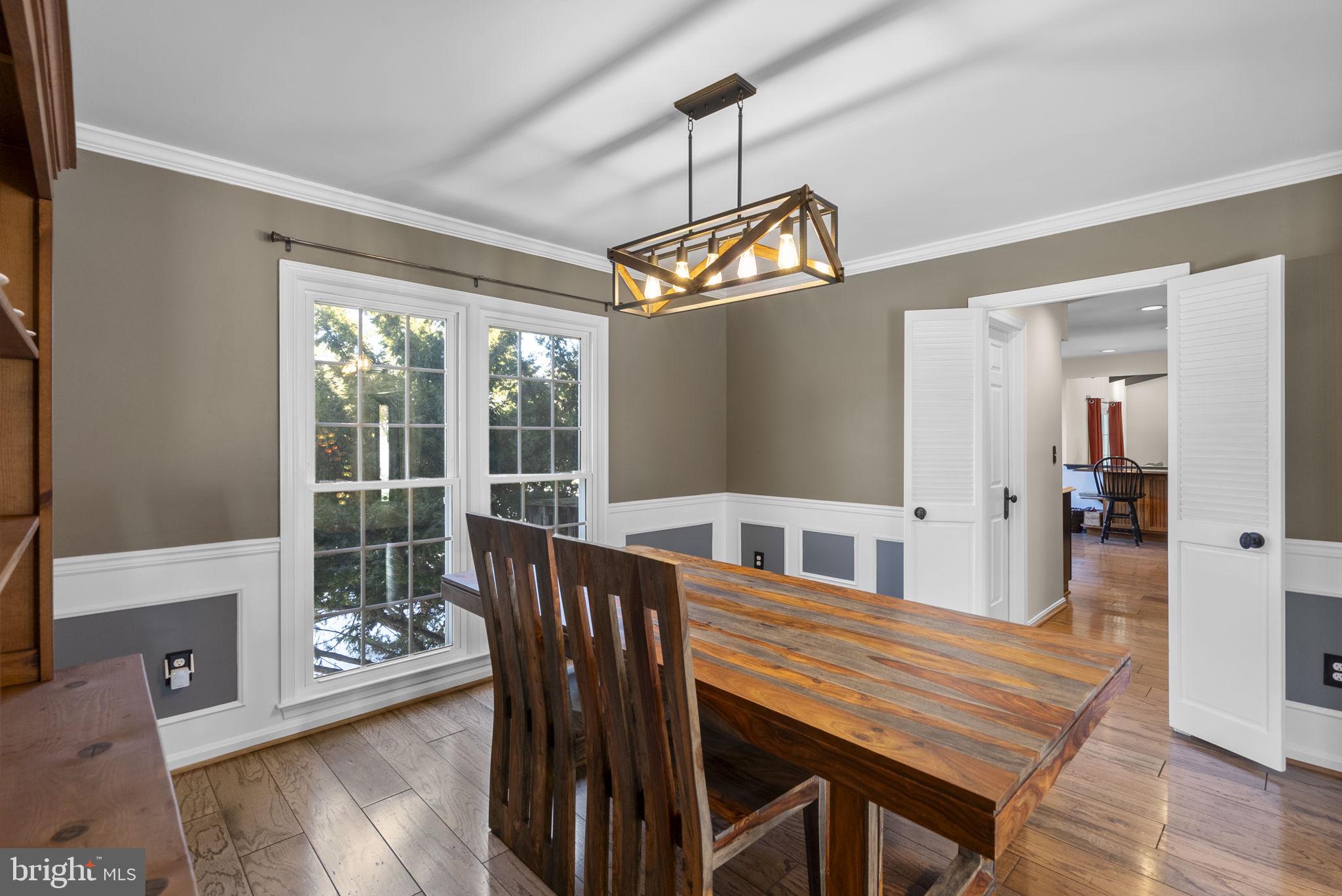 16424 Montecrest Lane Gaithersburg, MD 20878 - Photo 11 of 91 a view of a dining room with furniture window and wooden floor
