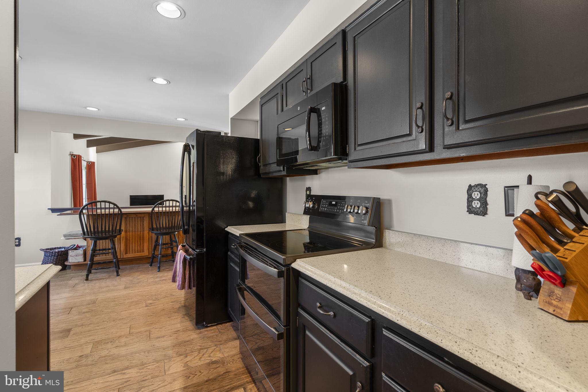 16424 Montecrest Lane Gaithersburg, MD 20878 - Photo 14 of 91 a kitchen with stainless steel appliances granite countertop a refrigerator and a stove top oven