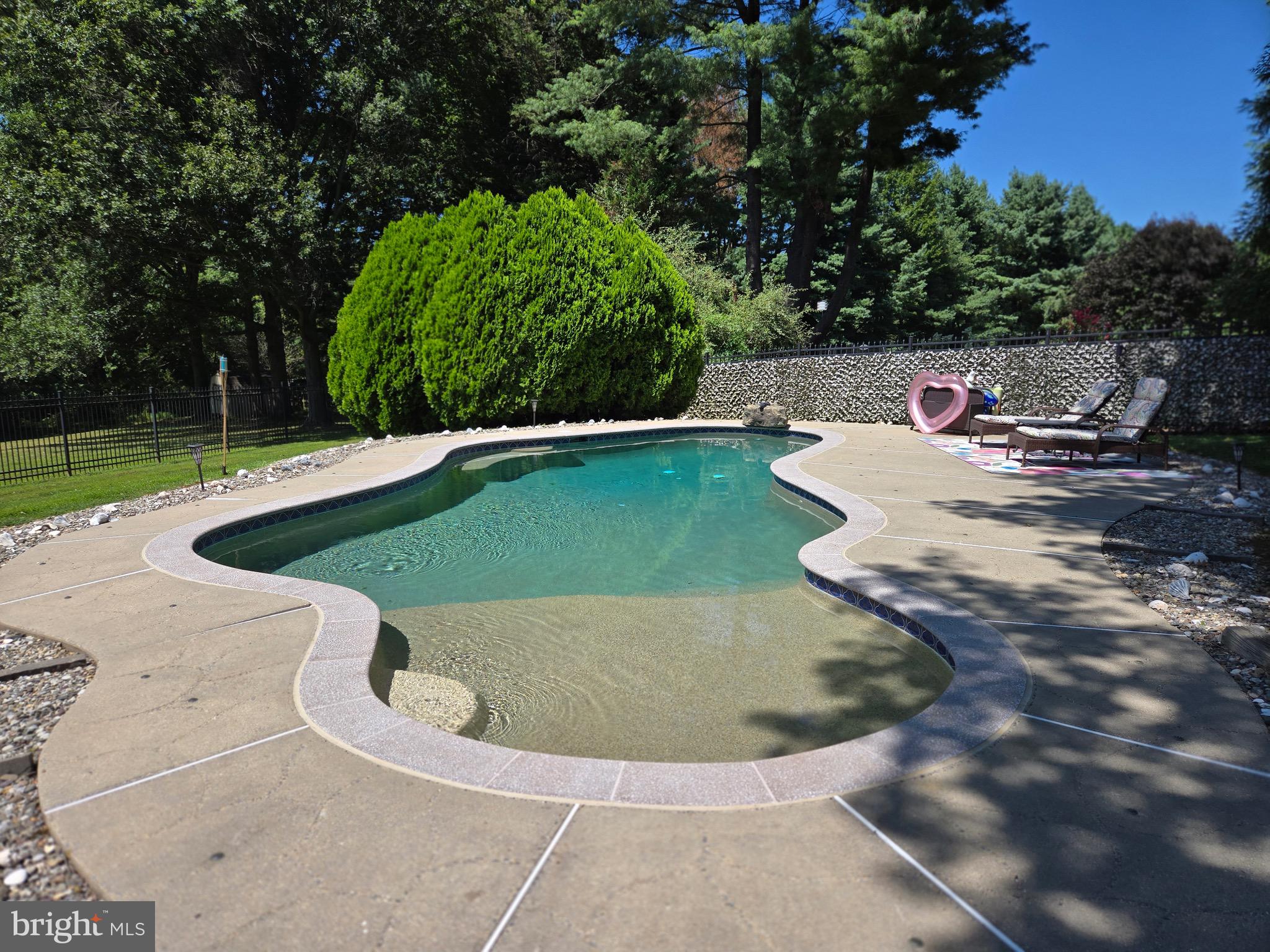 16424 Montecrest Lane Gaithersburg, MD 20878 - Photo 14 of 19 a view of a swimming pool with a yard