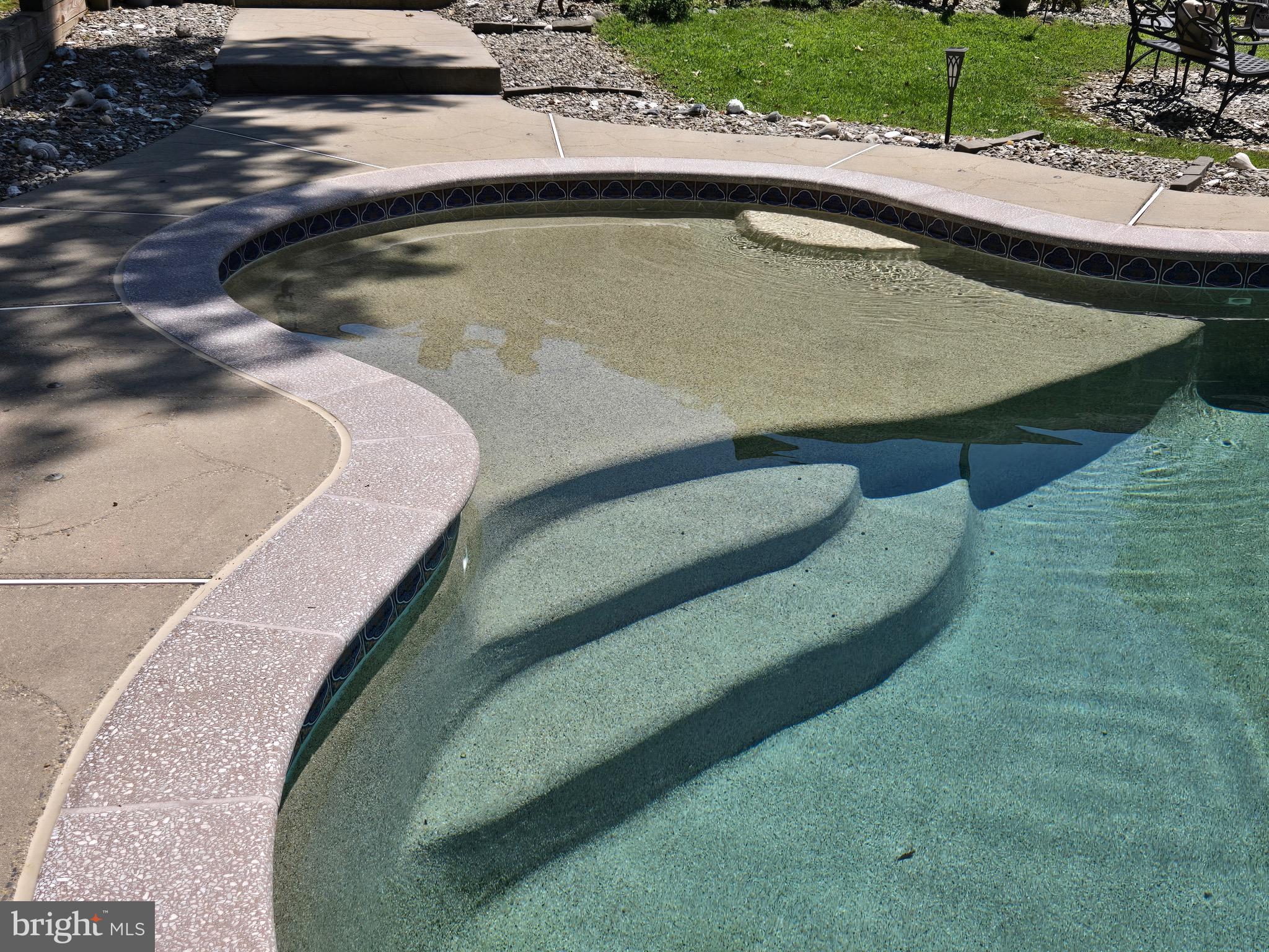 16424 Montecrest Lane Gaithersburg, MD 20878 - Photo 18 of 19 a view of a swimming pool with a yard
