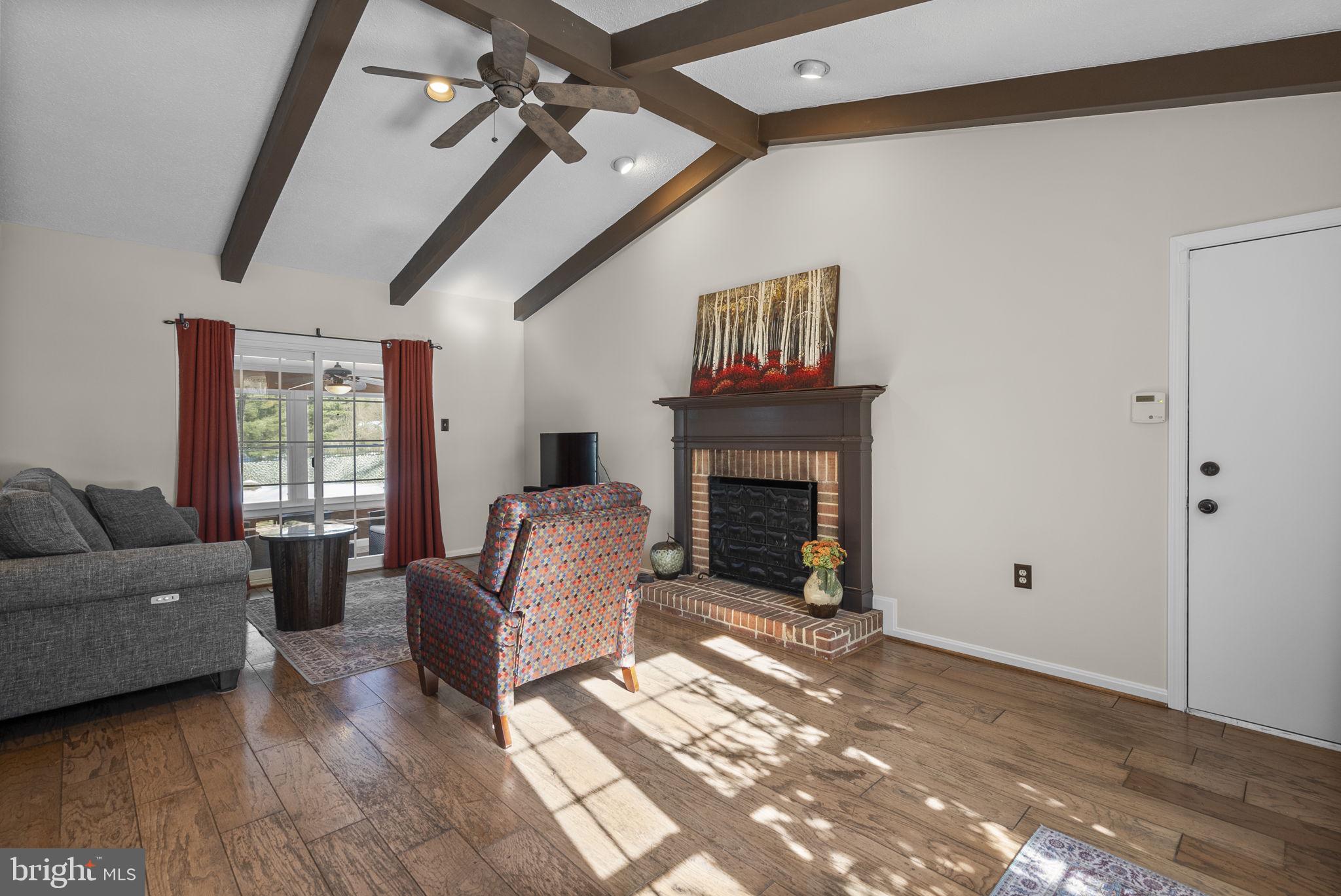16424 Montecrest Lane Gaithersburg, MD 20878 - Photo 20 of 91 a living room with furniture and a fireplace
