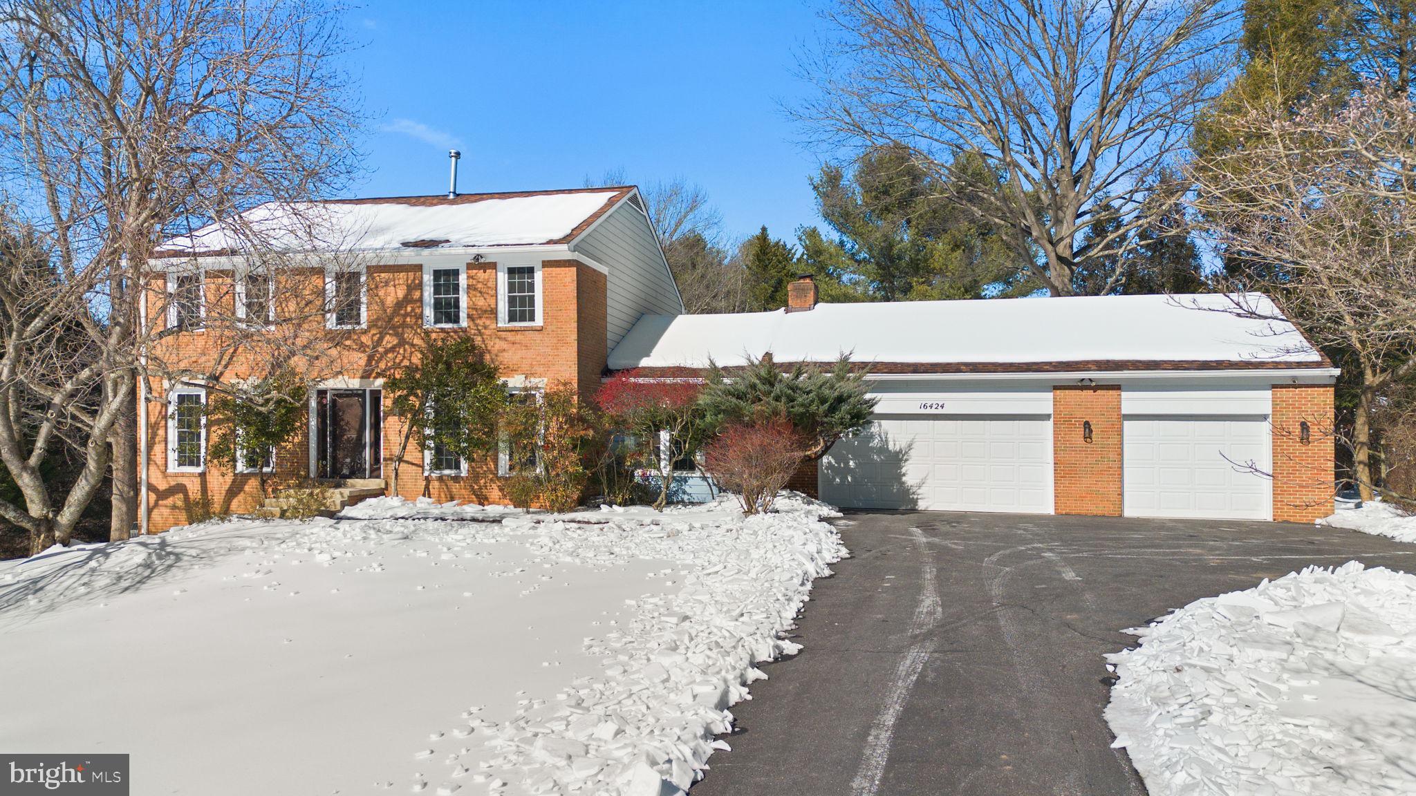 16424 Montecrest Lane Gaithersburg, MD 20878 - Photo 2 of 91 a view of a building with a snow on the road