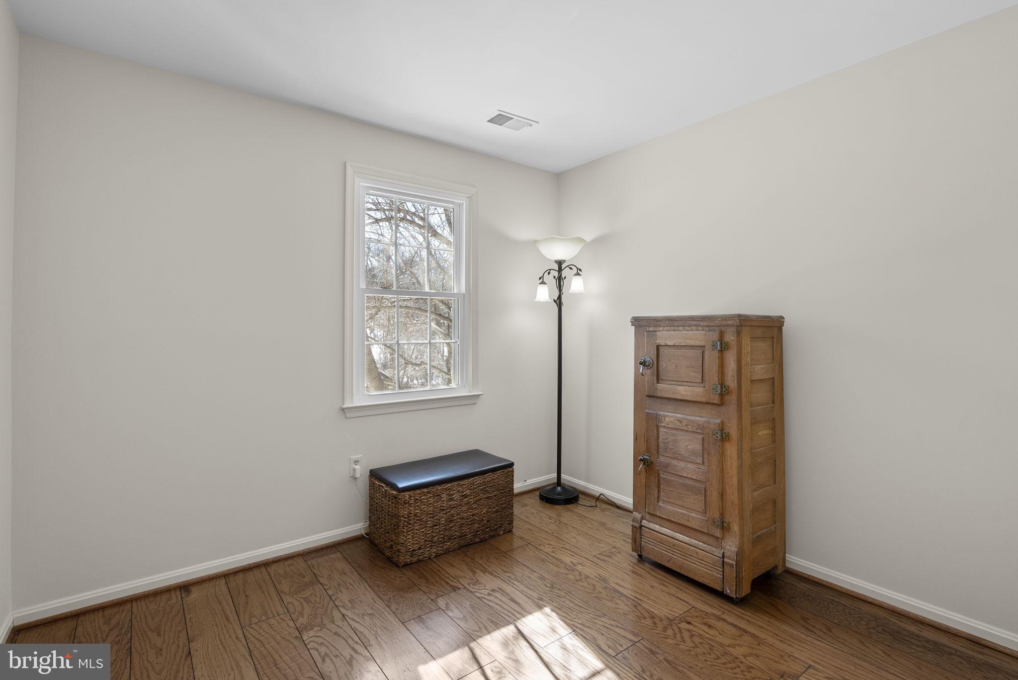 16424 Montecrest Lane Gaithersburg, MD 20878 - Photo 30 of 91 an empty room with wooden floor and window