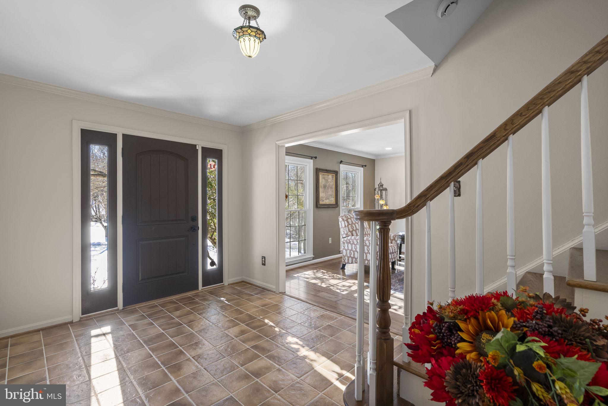 16424 Montecrest Lane Gaithersburg, MD 20878 - Photo 3 of 91 a view of an entryway with wooden floor and stairs