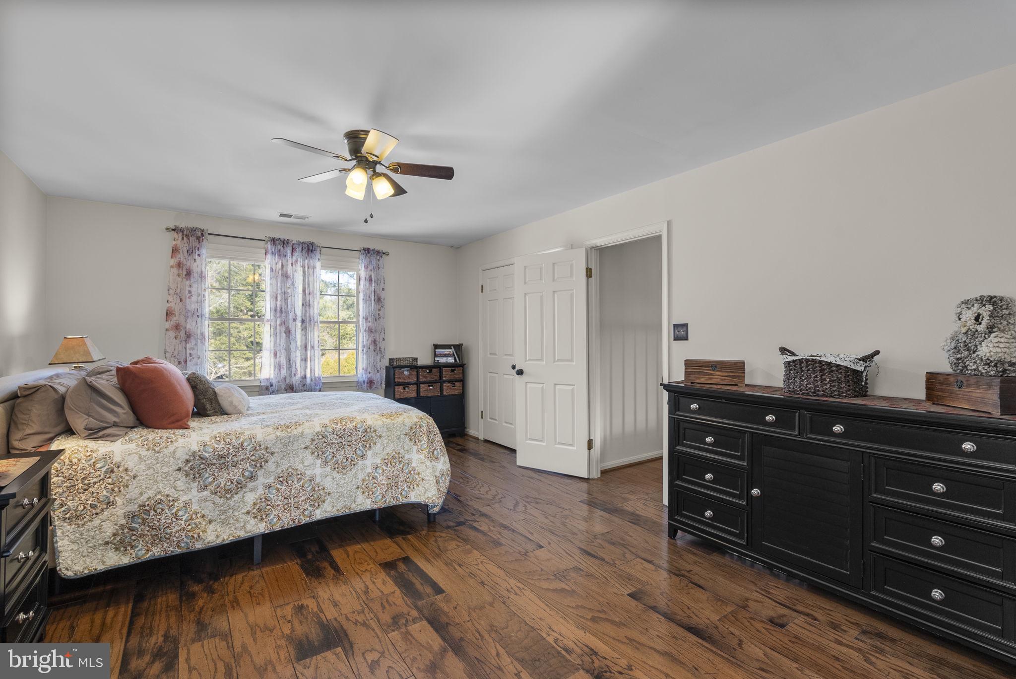 16424 Montecrest Lane Gaithersburg, MD 20878 - Photo 38 of 91 a bedroom with a bed and wooden floor