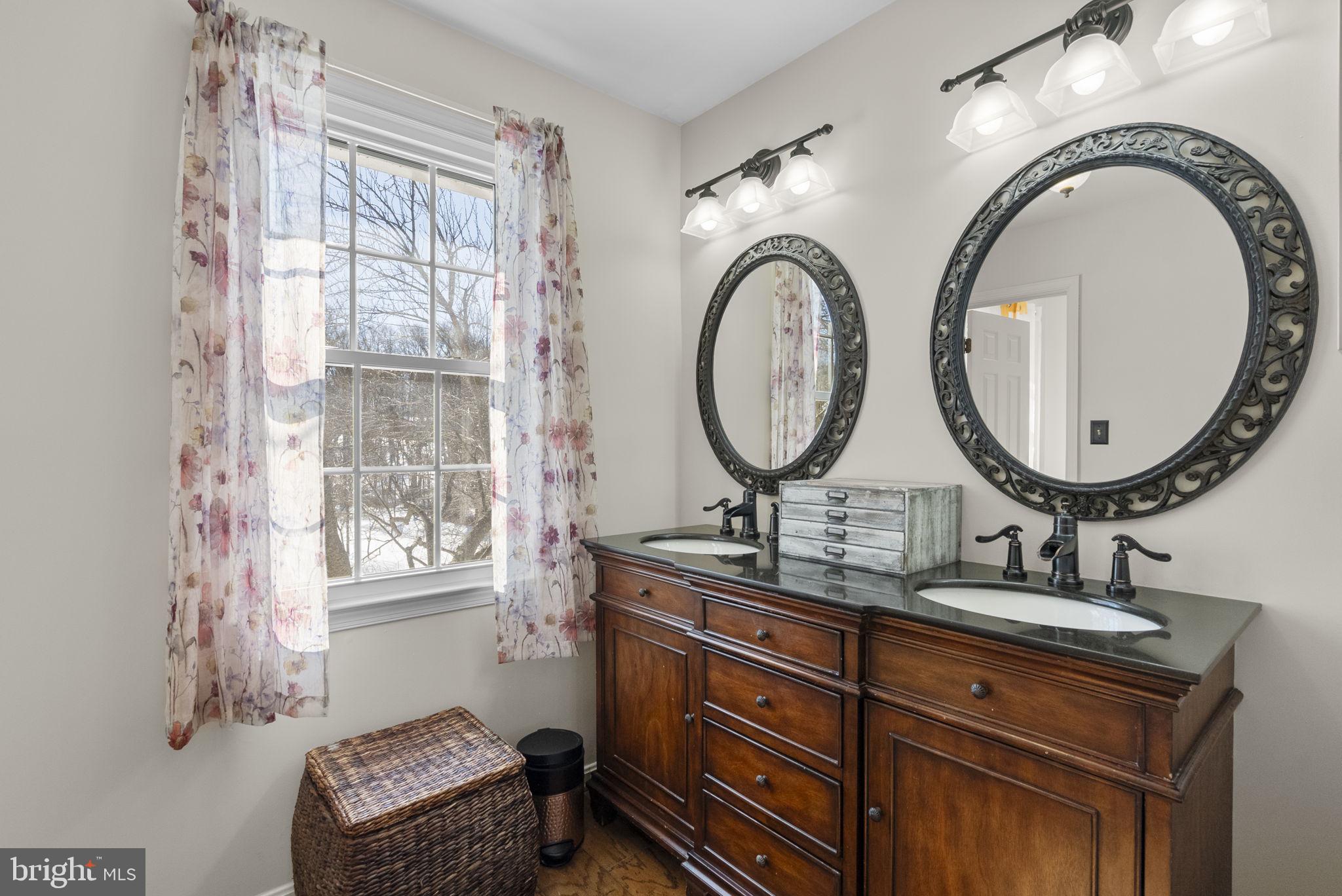16424 Montecrest Lane Gaithersburg, MD 20878 - Photo 41 of 91 a bathroom with a granite countertop double vanity sink and a mirror