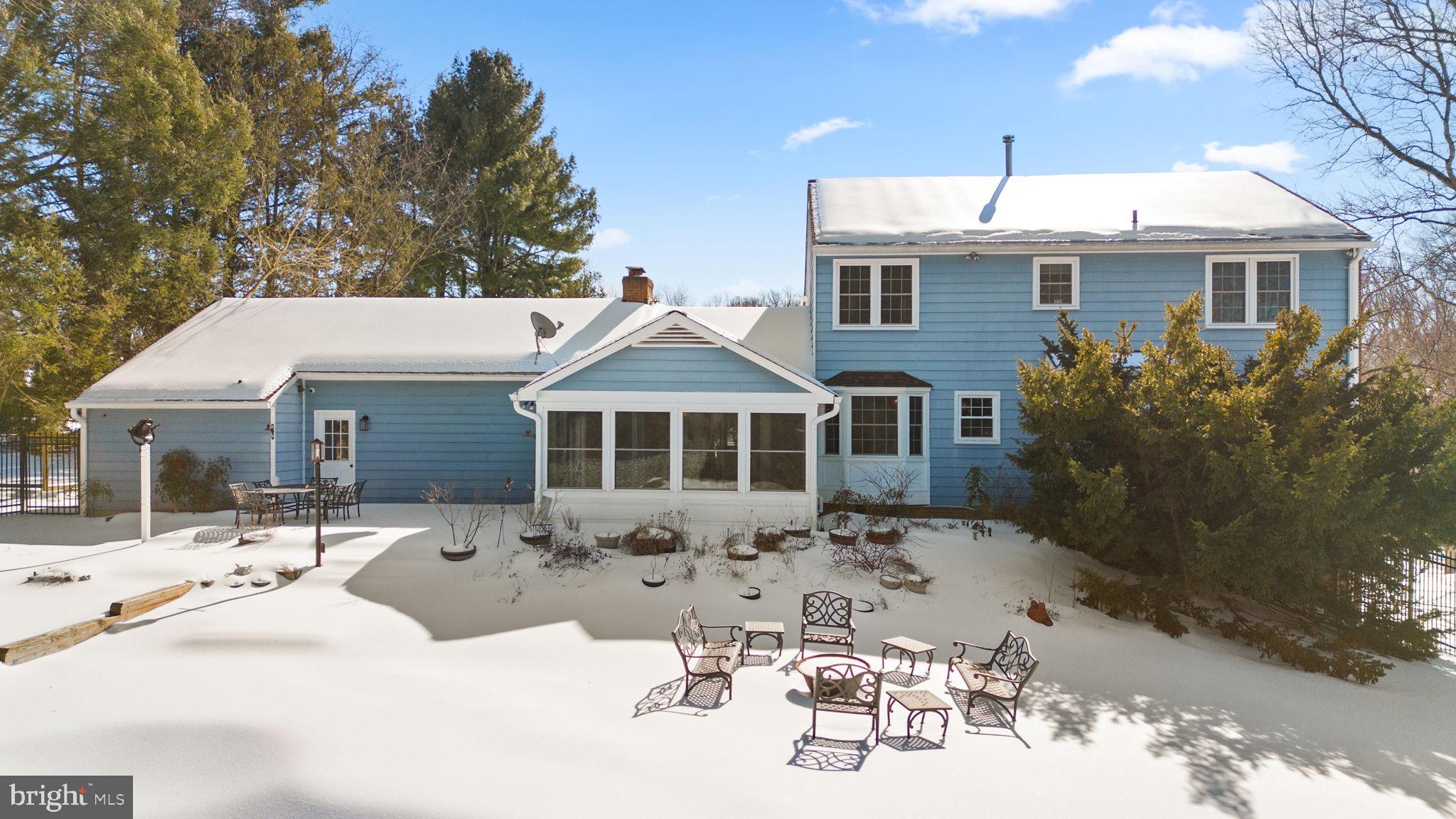 16424 Montecrest Lane Gaithersburg, MD 20878 - Photo 54 of 91 a view of a house with a yard covered in snow