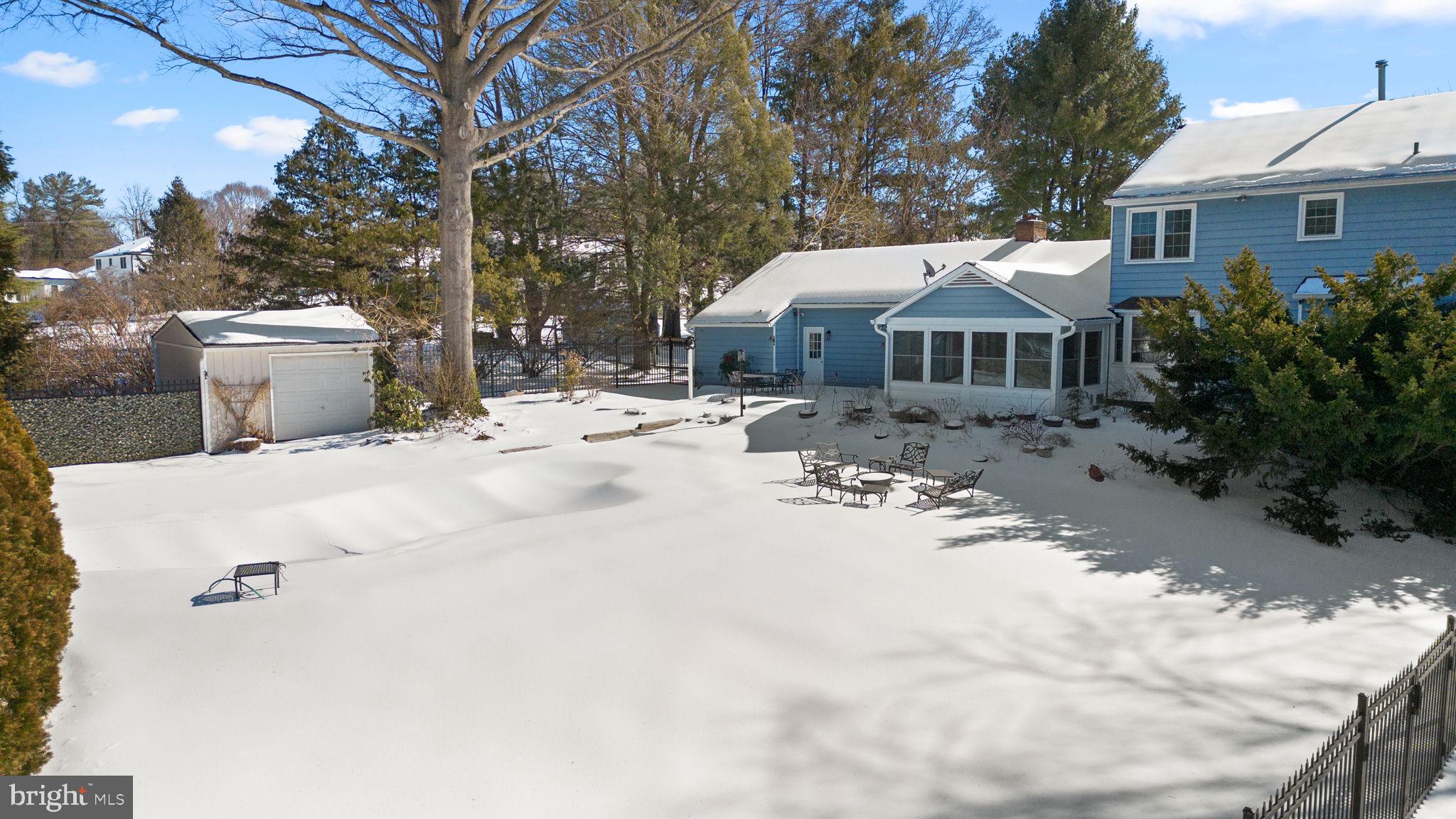 16424 Montecrest Lane Gaithersburg, MD 20878 - Photo 56 of 91 a view of a house with a yard covered in snow