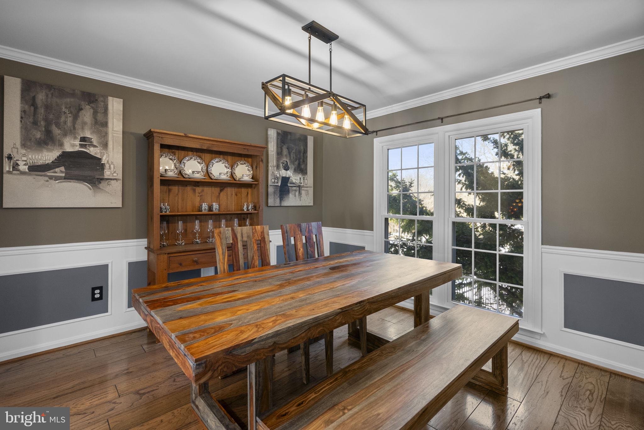 16424 Montecrest Lane Gaithersburg, MD 20878 - Photo 10 of 91 a view of a dining room with furniture a chandelier and wooden floor
