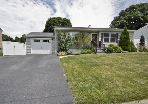 front view of a house with a big yard