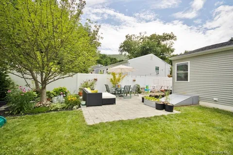 a bathroom with a sink and a yard