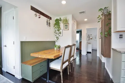a living room with a bed and a window