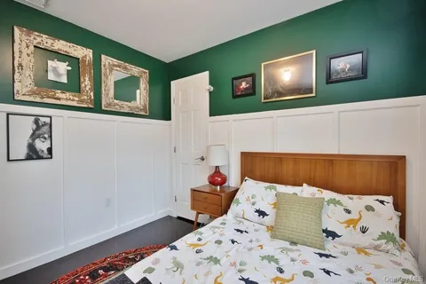 a bedroom with a bed and a dresser