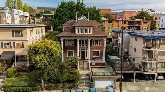 a view of a brick building next to a yard