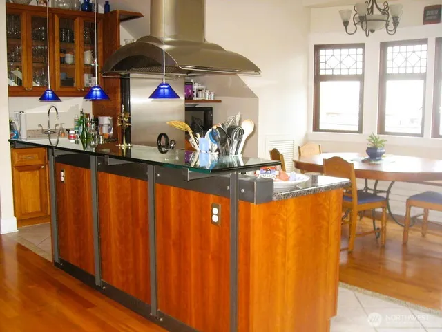 a kitchen with sink and cabinets