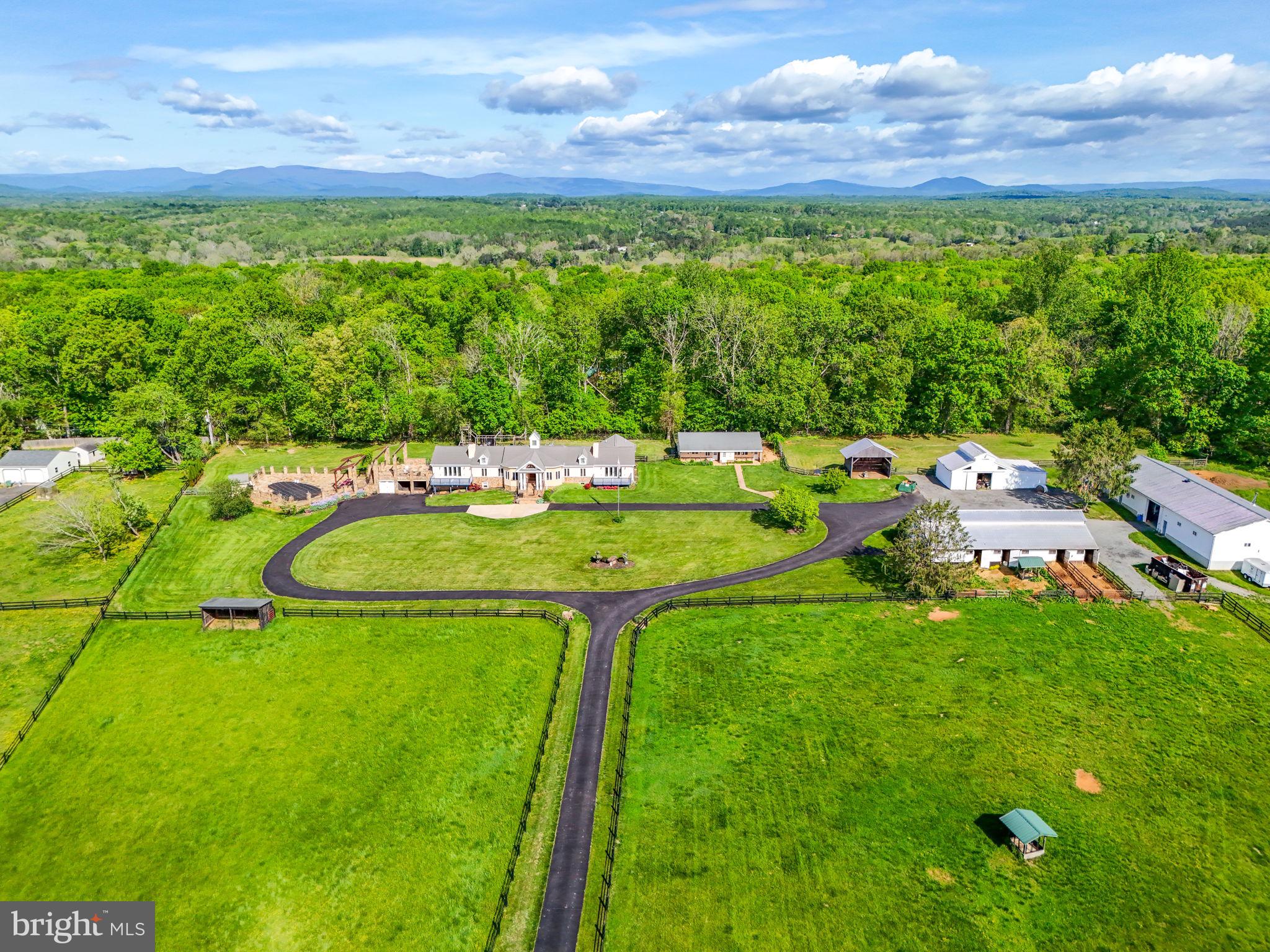 8511 Leeds Manor Road Warrenton, VA 20186 - Photo 15 of 36 a view of swimming pool with a garden and outdoor seating