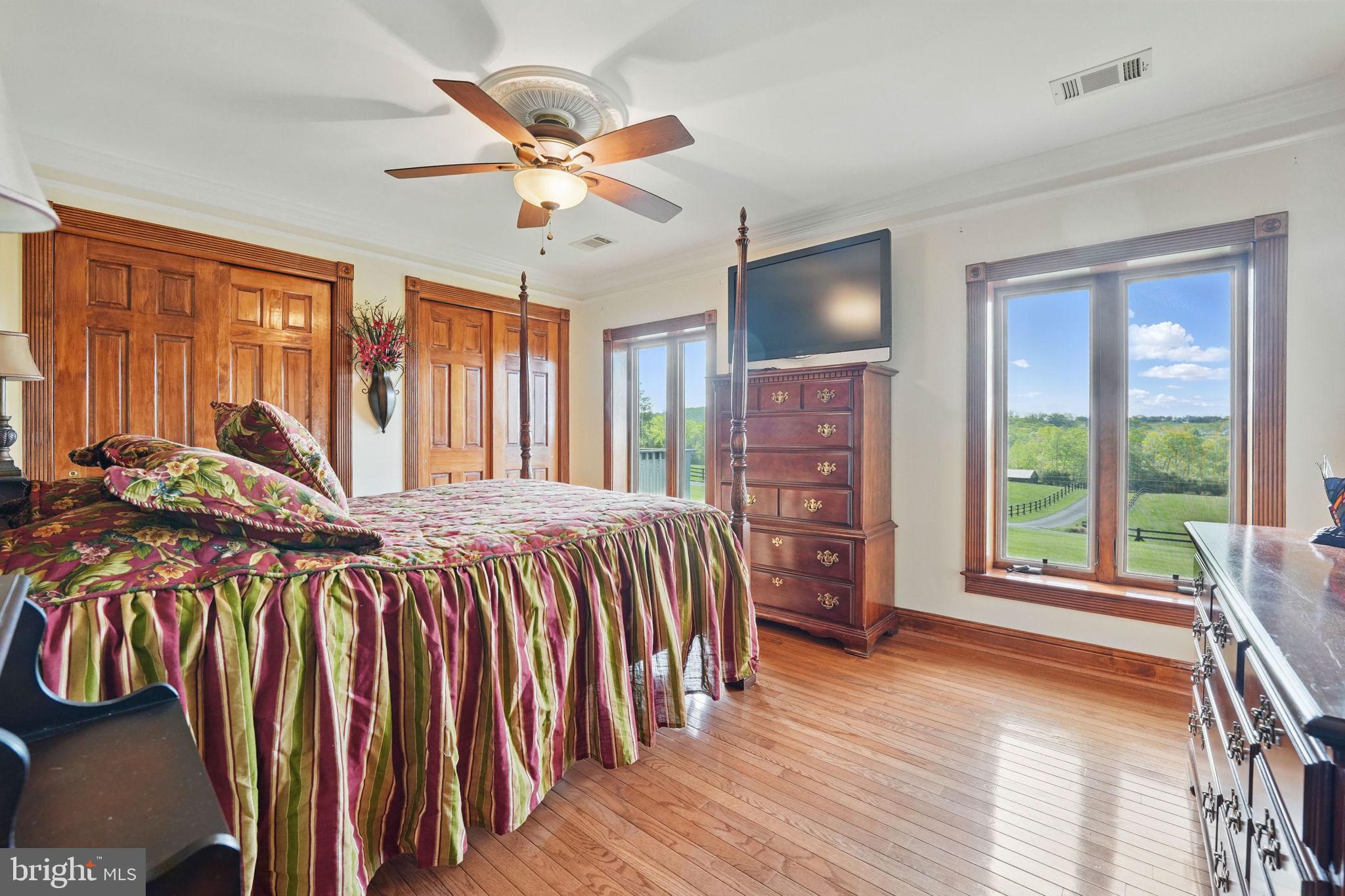 8511 Leeds Manor Road Warrenton, VA 20186 - Photo 25 of 36 a bed sitting in a spacious bedroom next to a window