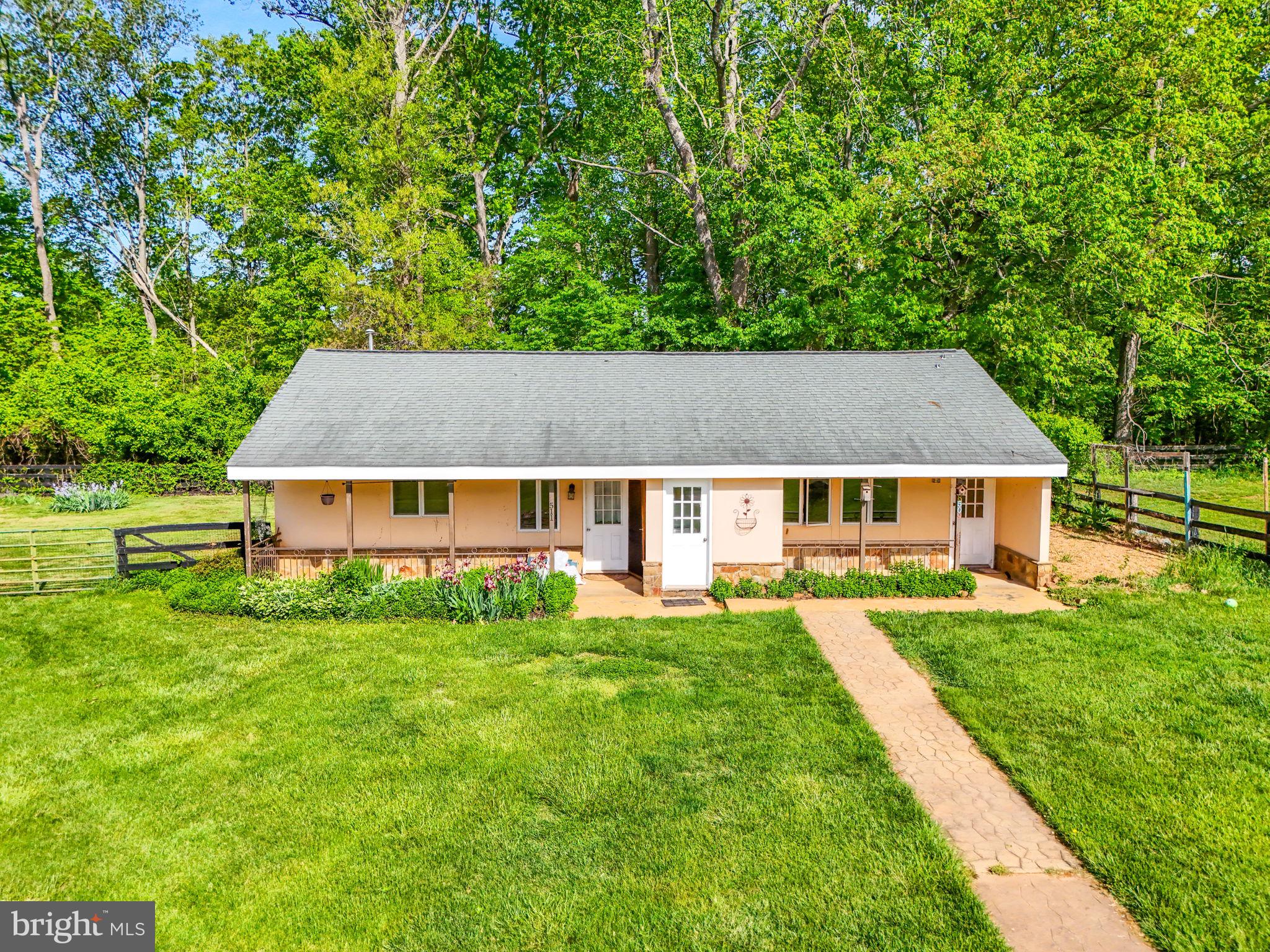 8511 Leeds Manor Road Warrenton, VA 20186 - Photo 9 of 36 a aerial view of a house next to a big yard