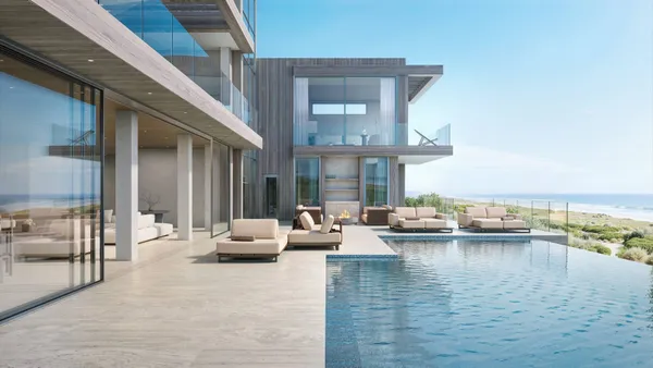 an outdoor living space with furniture and city view