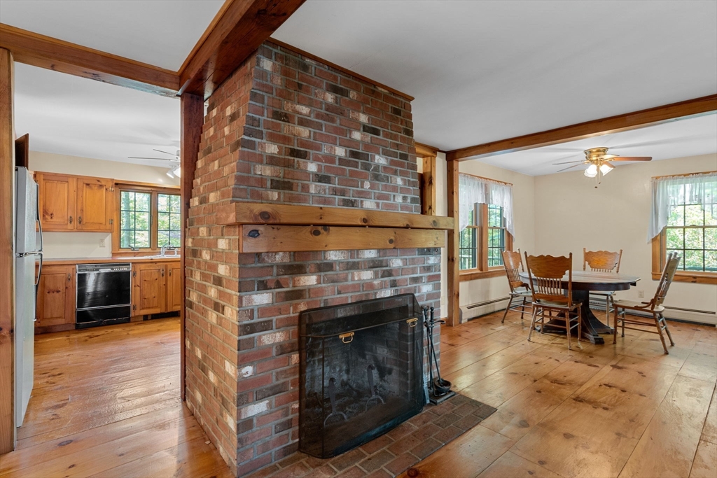 362 Snows Pond Road Rochester, MA 02770 - Photo 7 of 41 a living room with furniture and a fireplace