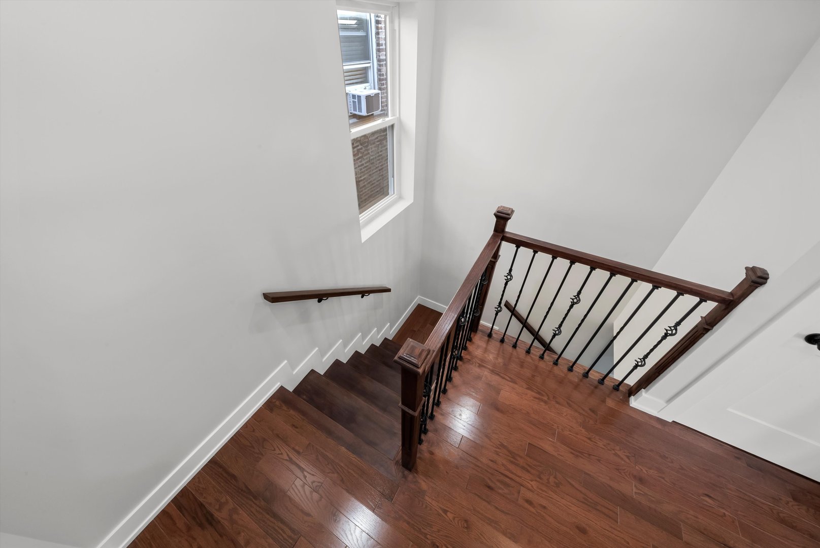 1631 North Parkside Avenue Chicago, IL 60639 - Photo 5 of 33 a view of staircase with white walls and a window