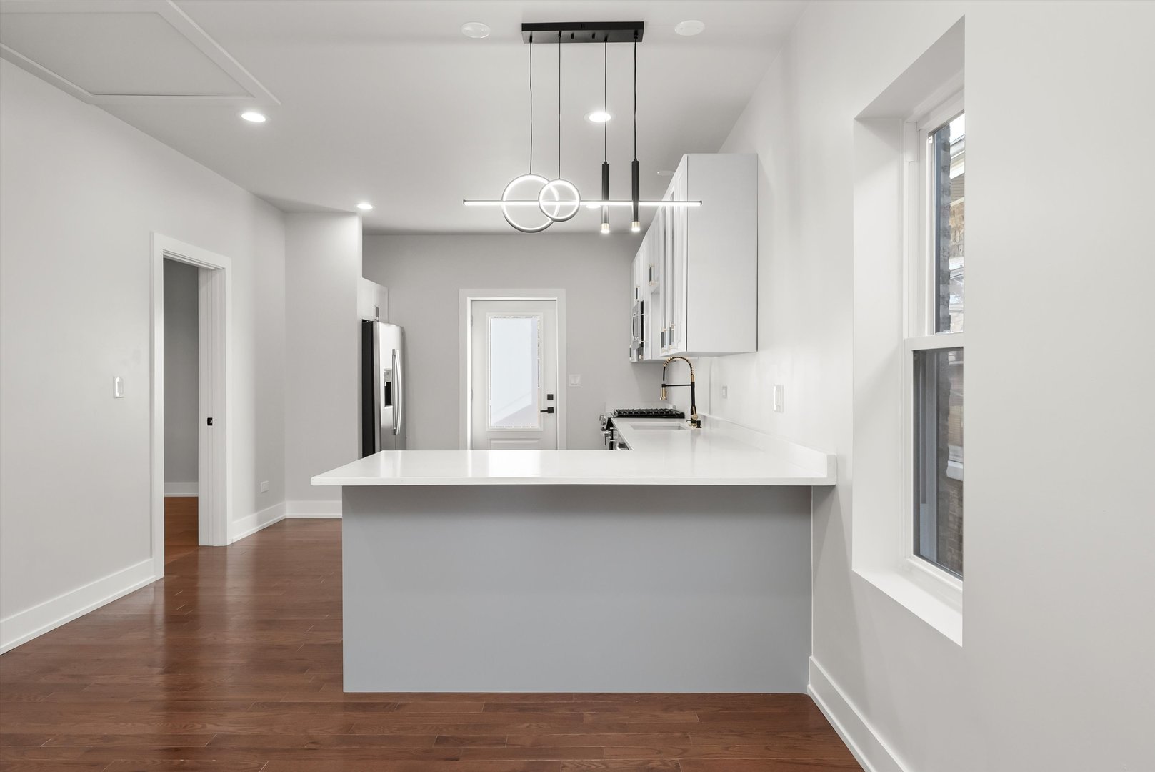 1631 North Parkside Avenue Chicago, IL 60639 - Photo 8 of 33 a kitchen with kitchen island a sink appliances and cabinets