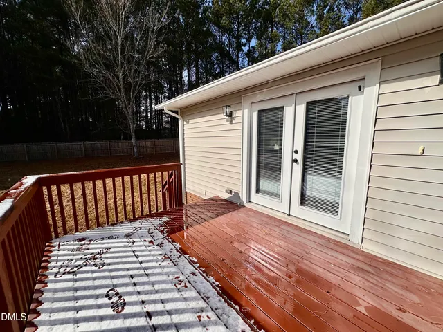 a view of a balcony with wooden floor