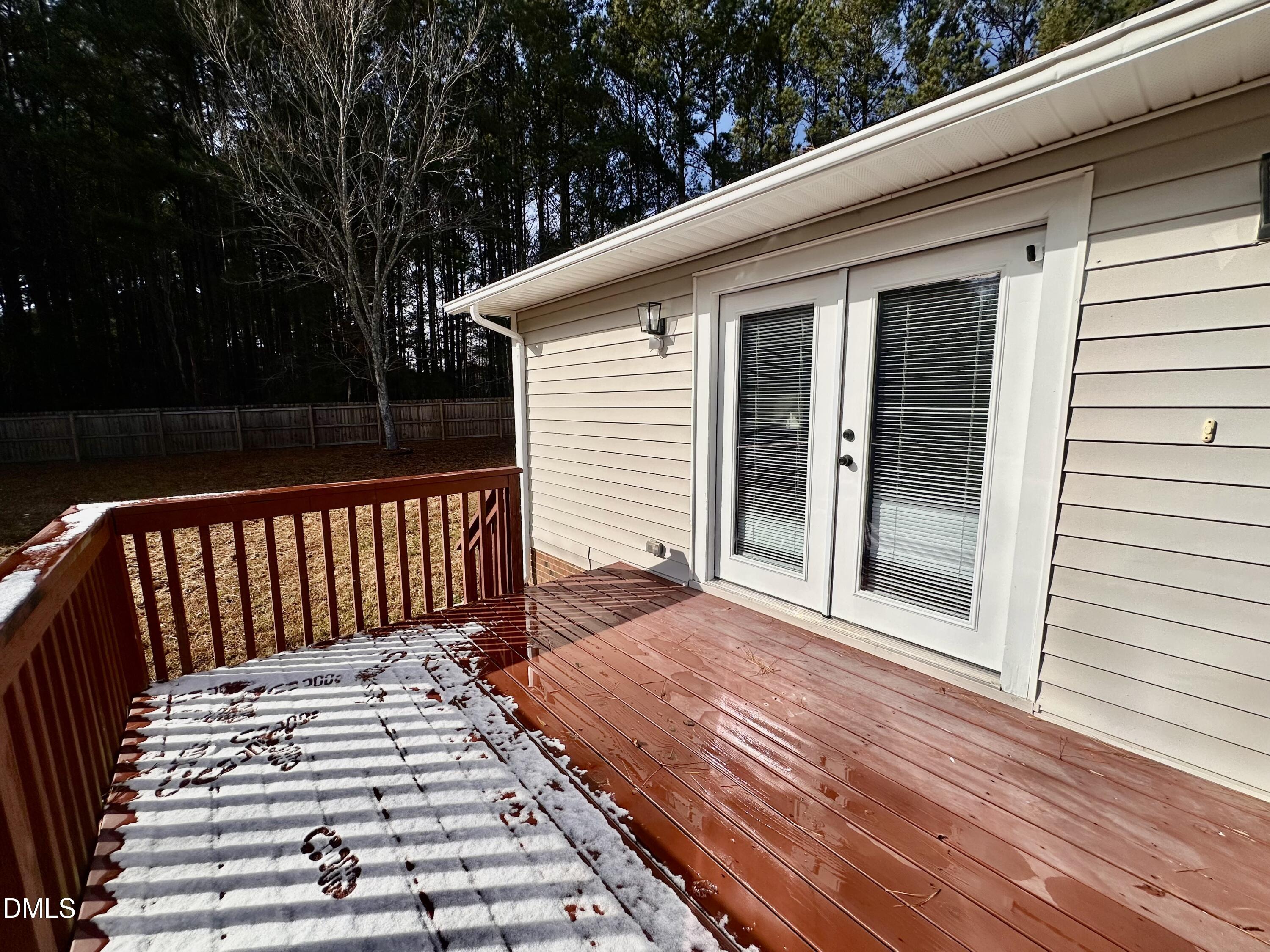 420 Tippett Road Zebulon, NC 27597 - Photo 13 of 14 a view of a balcony with wooden floor