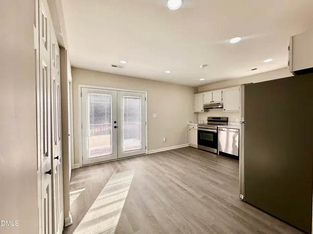 a view of kitchen with wooden floor