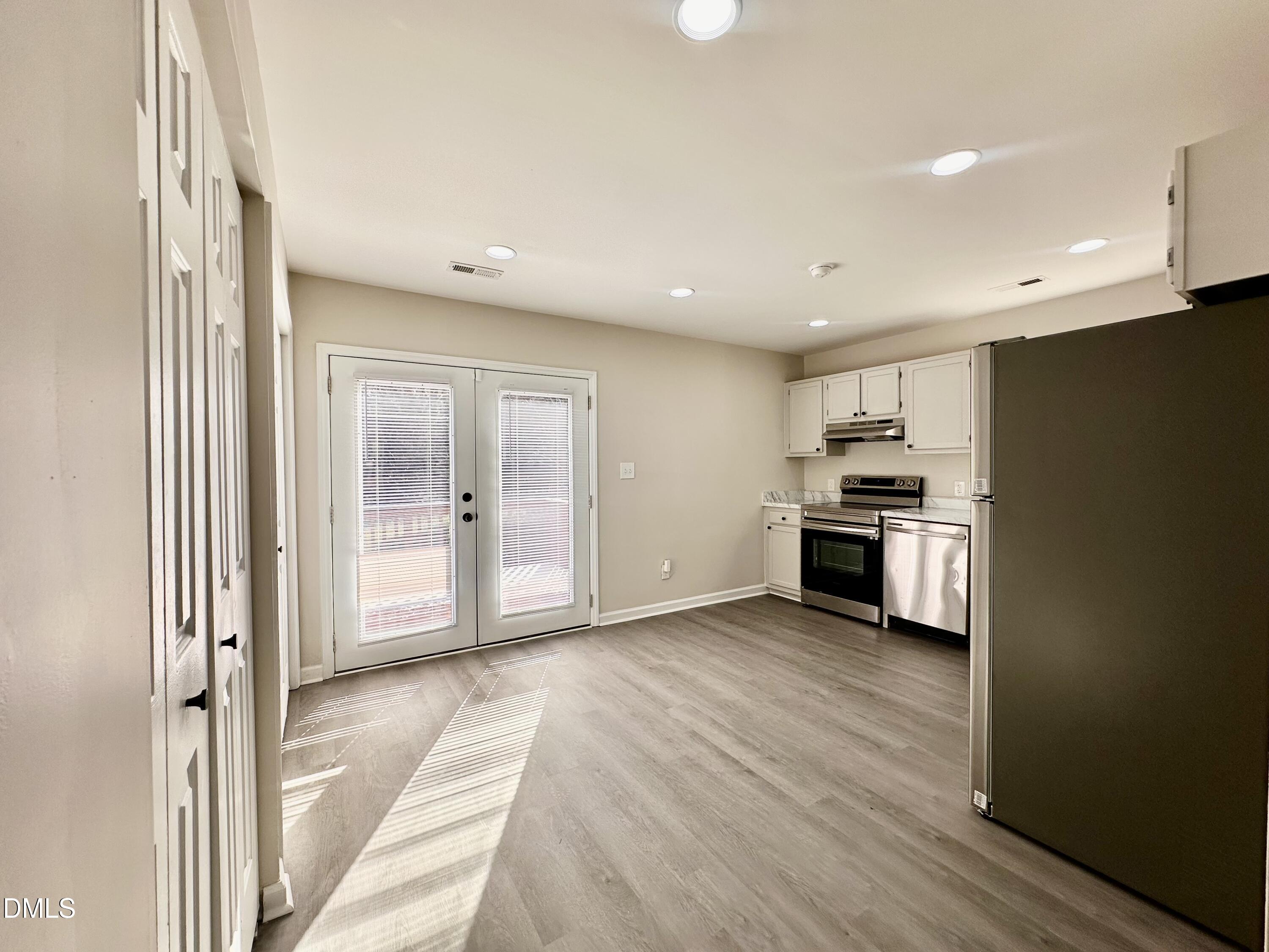 420 Tippett Road Zebulon, NC 27597 - Photo 3 of 14 a view of kitchen with wooden floor