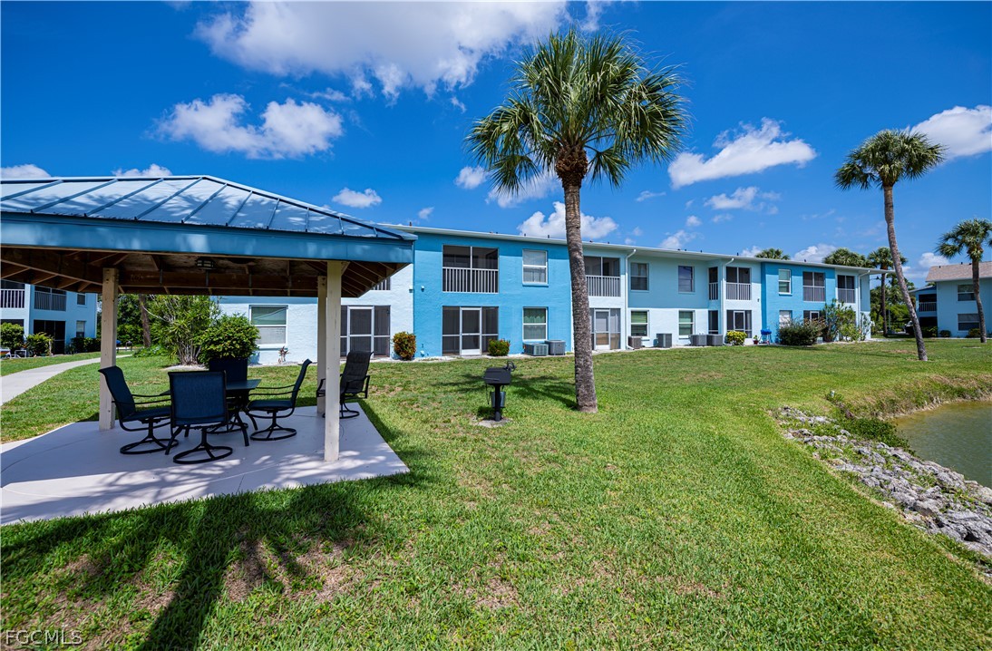 1100 Pondella Road, Unit 514 Cape Coral, FL 33909 - Photo 5 of 34 a view of a house with a yard porch and sitting area