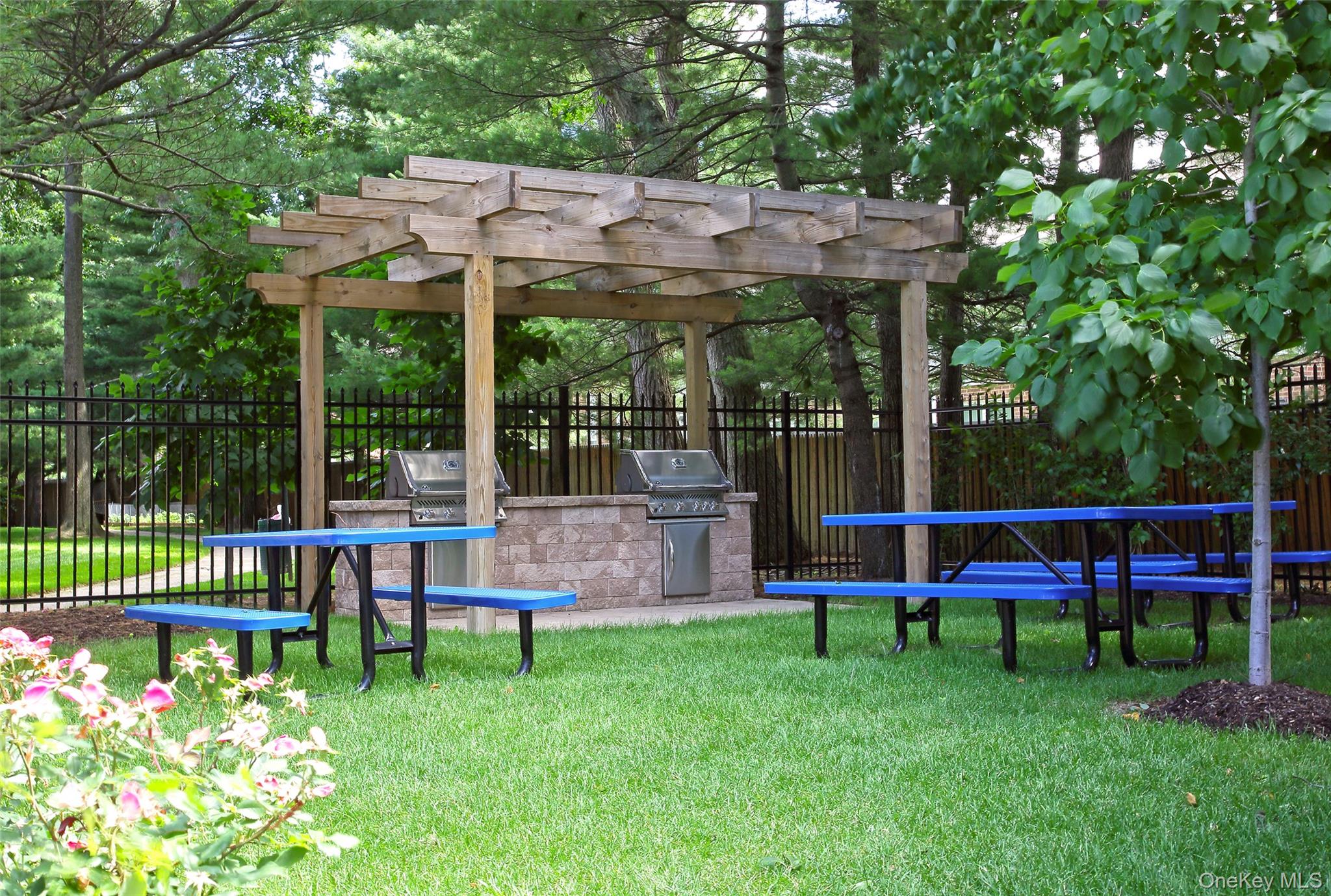 7 Spinning Wheel Road, Unit 1B Massapequa, NY 11758 - Photo 12 of 12 a view of park with an outdoor seating