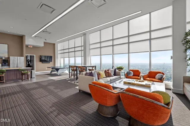 a view of a swimming pool with a table and chairs