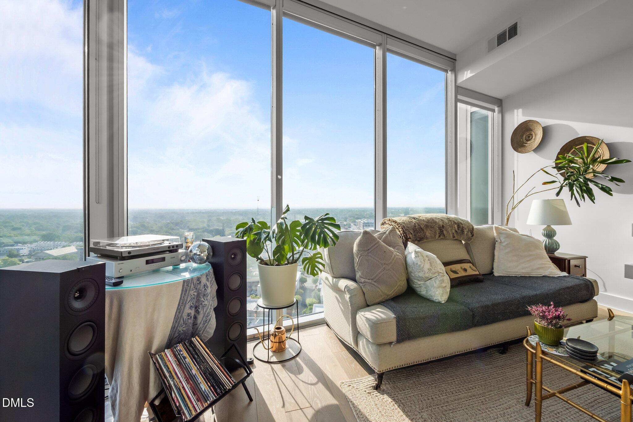 110 Corcoran Street, Unit 2101 Durham, NC 27701 - Photo 5 of 23 a living room with furniture and large windows