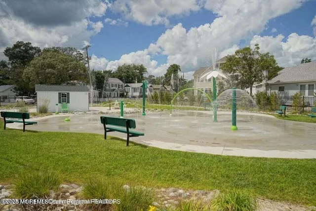 a view of a park with swings and slides
