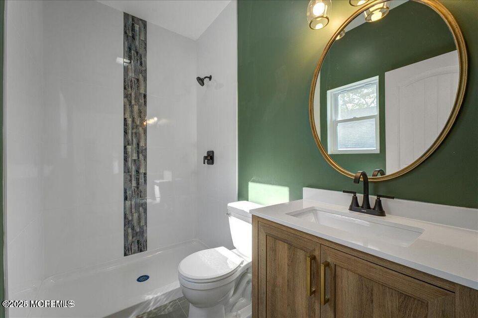 553 Ocean Gate Drive Ocean Gate, NJ 08740 - Photo 6 of 25 a bathroom with a sink and a mirror