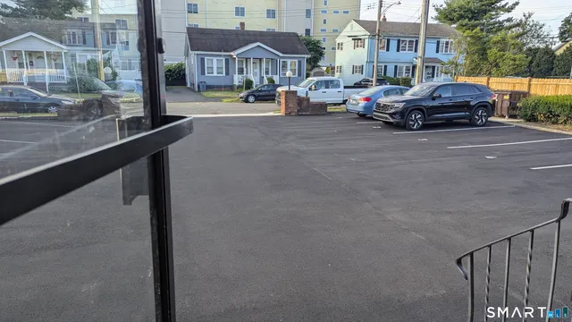 a view of street with parked cars