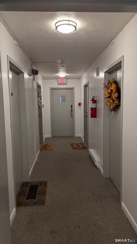 en empty room with windows and furniture