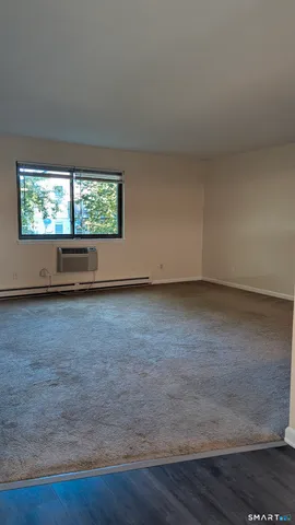 a view of room with hardwood floor