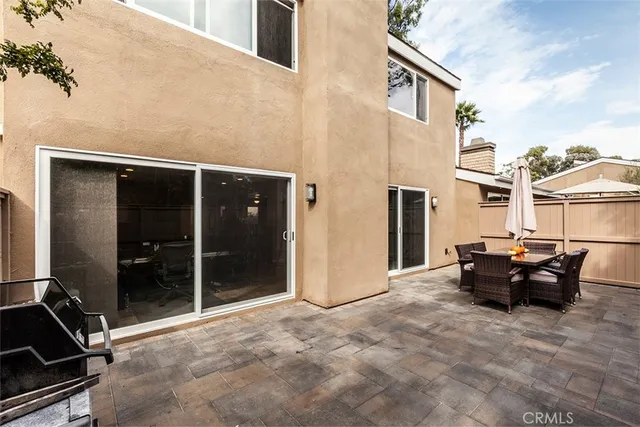 a view of backyard with wheel chair and potted plants