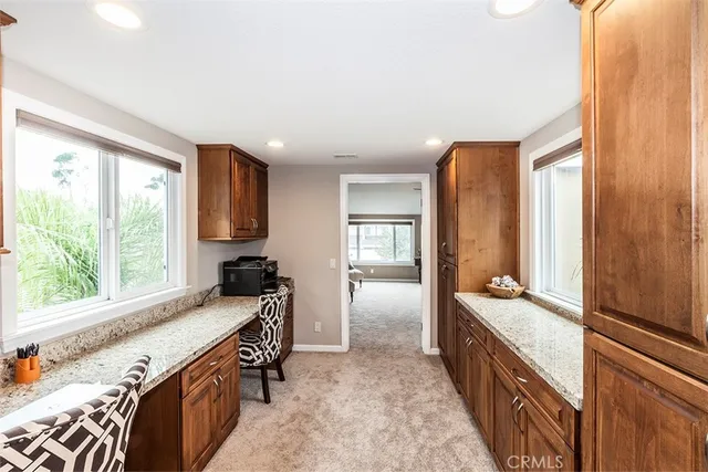 a room with a bed and a large window