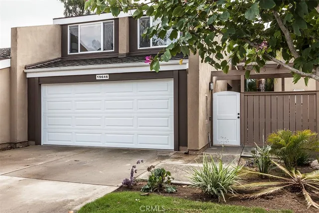 a house with a tree in front of it