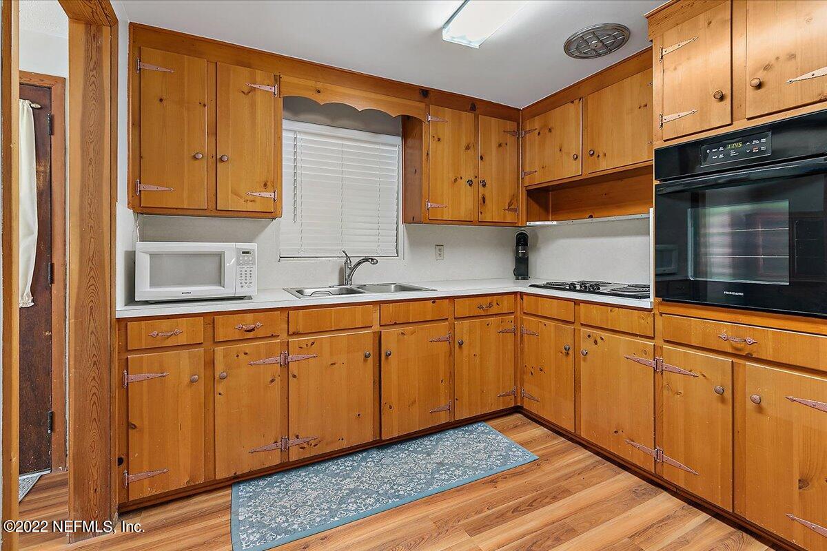 5848 Ensenada Road Jacksonville, FL 32244 - Photo 4 of 18 a kitchen with granite countertop cabinets stainless steel appliances and a sink