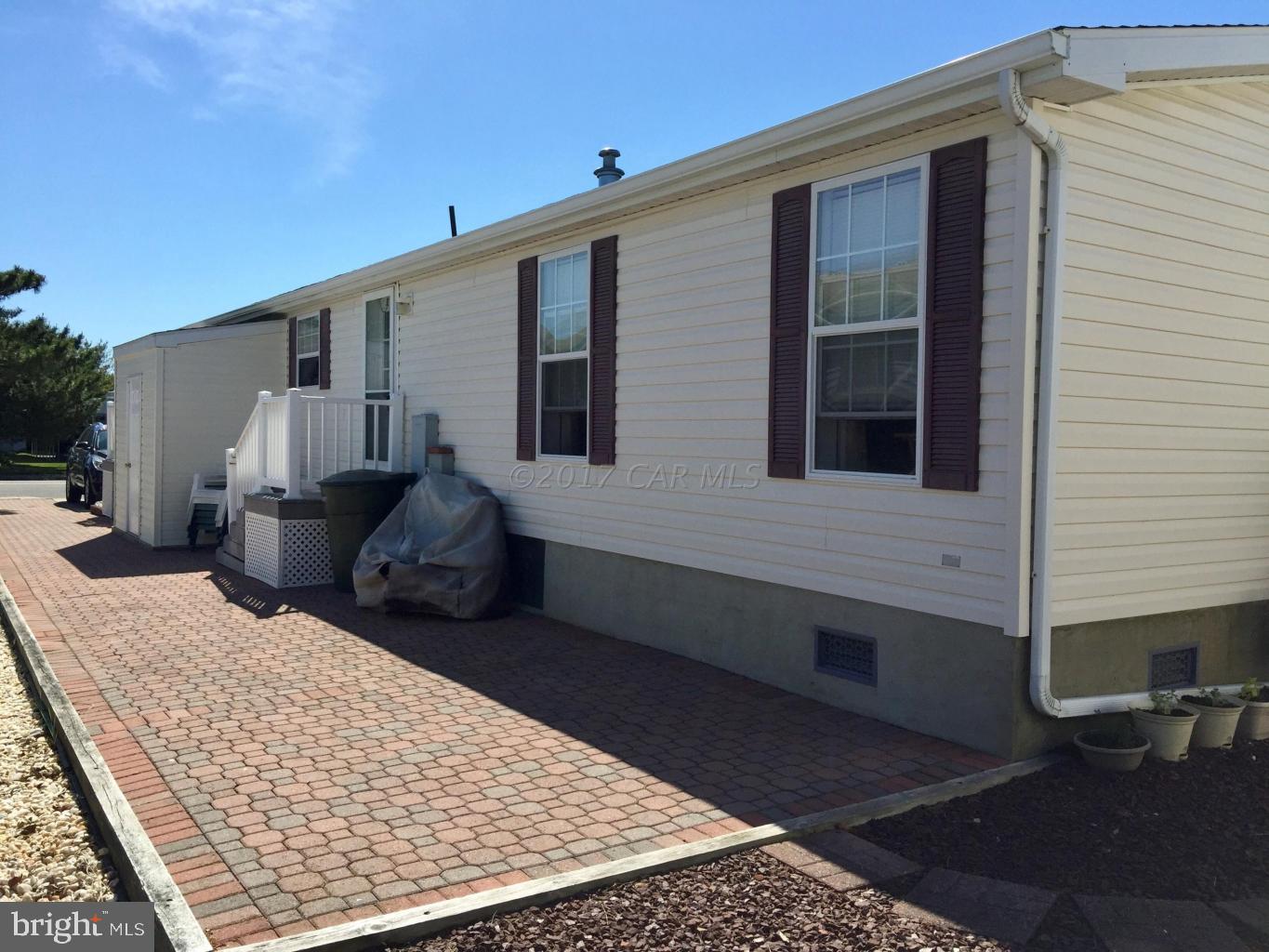 120 Clamshell Road Ocean City, MD 21842 - Photo 4 of 47 Full Length Brick Paver Side Patio
