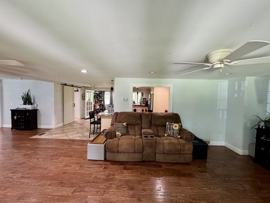 334 Chapin Road Hampden, MA 01036 - Photo 8 of 28 a living room with furniture and a wooden floor