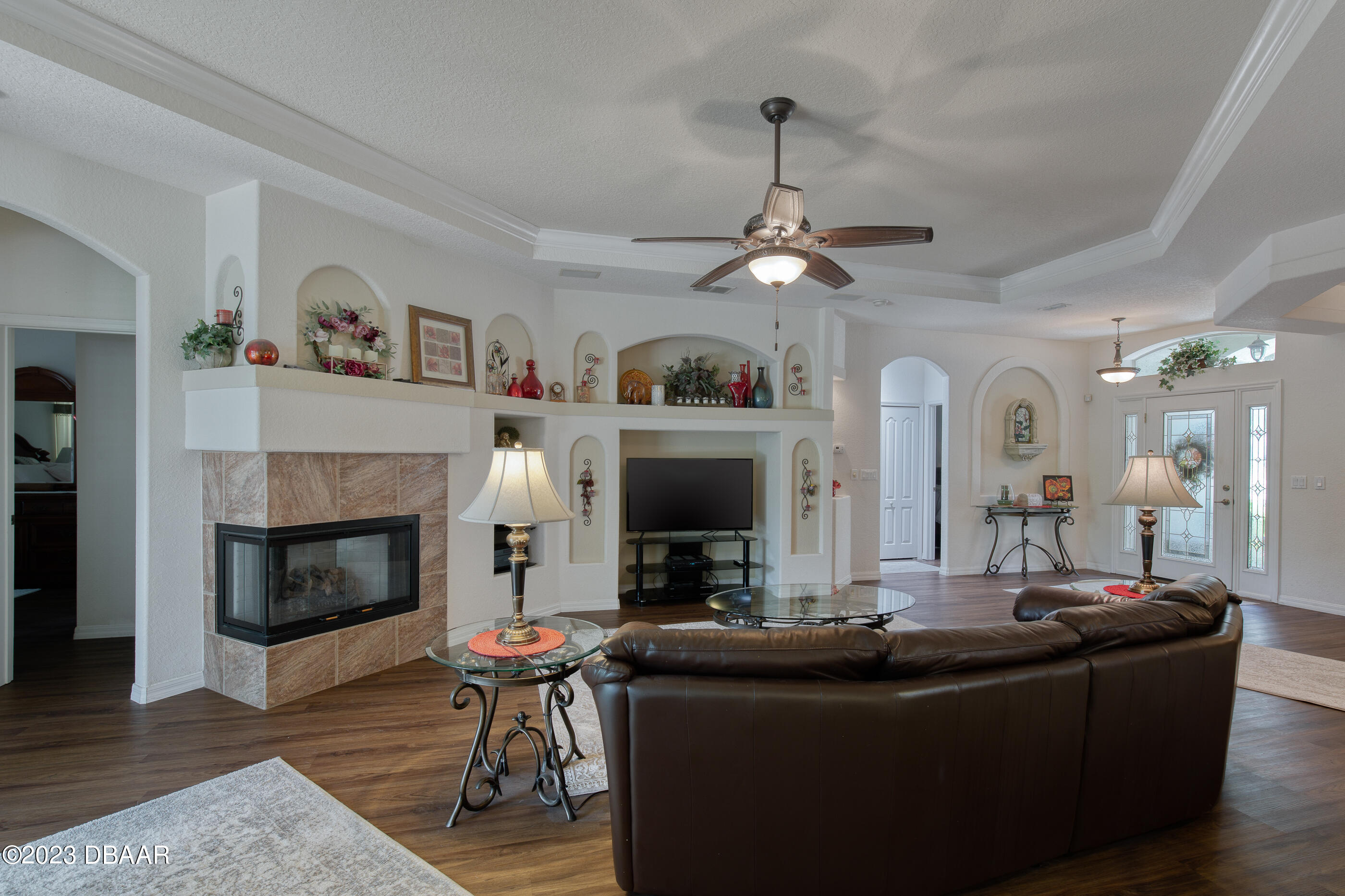 87 Timucuan Drive Ormond Beach, FL 32174 - Photo 11 of 63 a living room with fireplace furniture and a fireplace