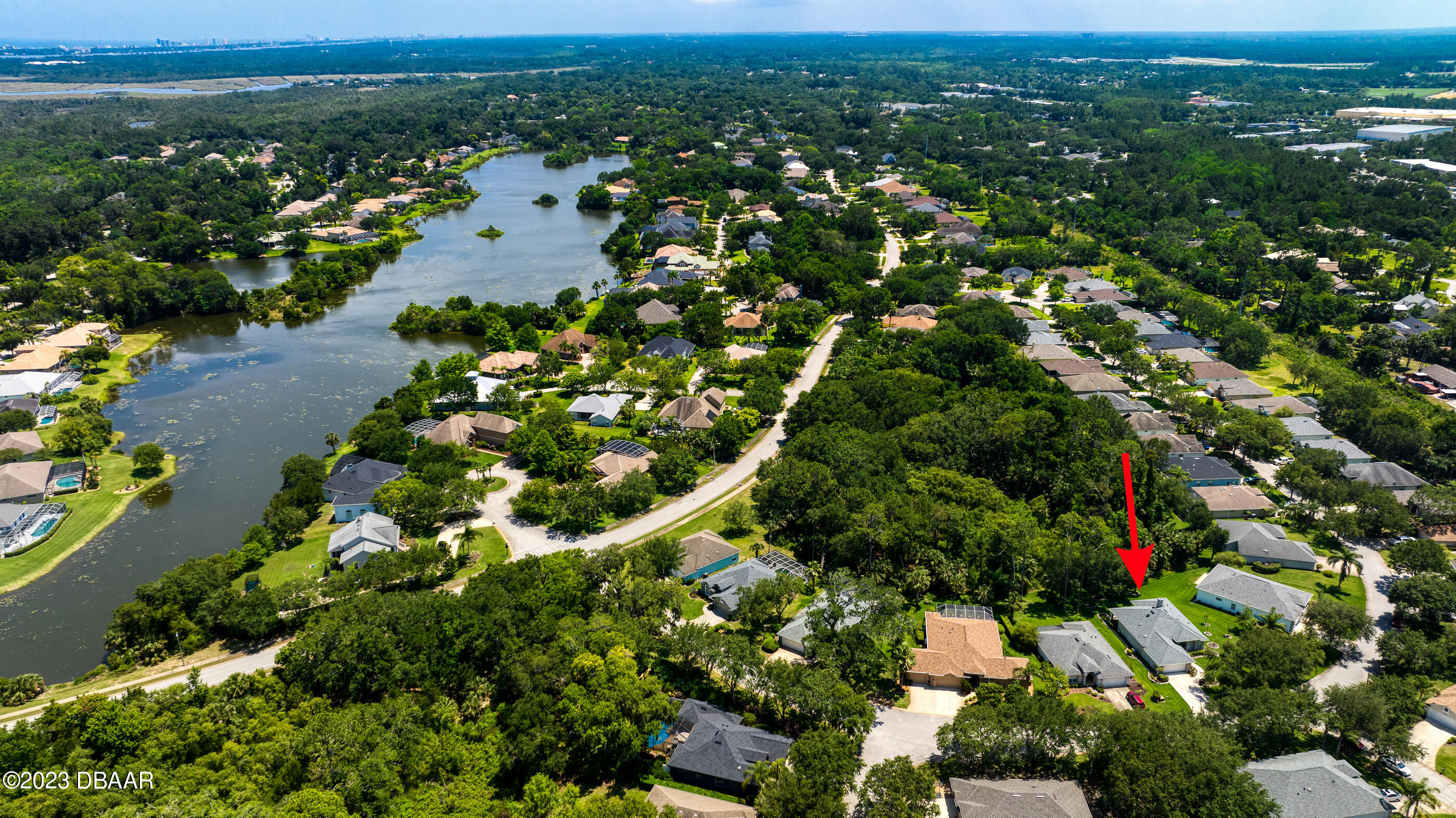 87 Timucuan Drive Ormond Beach, FL 32174 - Photo 2 of 63 an aerial view of residential houses with outdoor space and trees