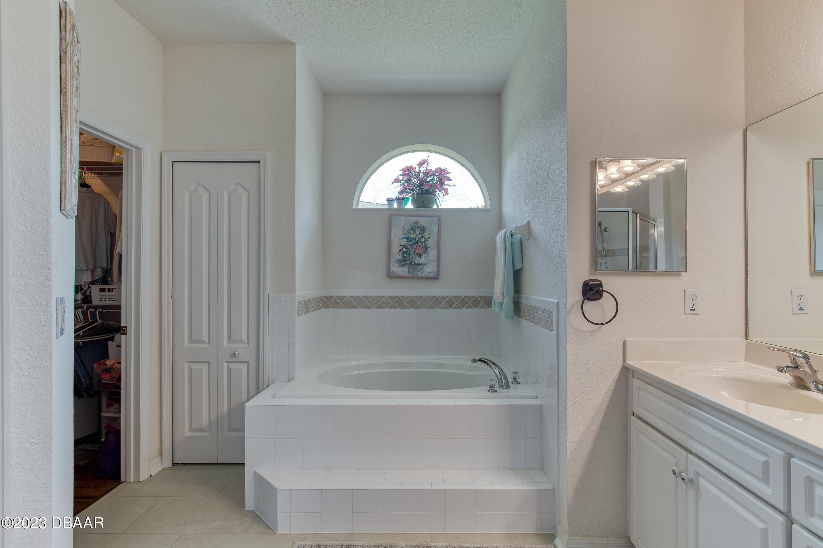 87 Timucuan Drive Ormond Beach, FL 32174 - Photo 23 of 63 a bathroom with a tub and a sink